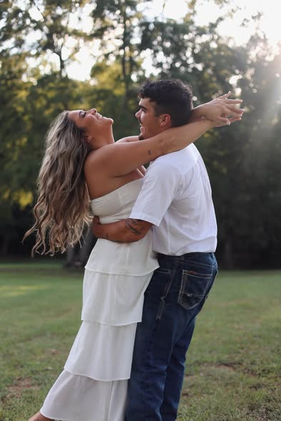 Couple laughing together during an outdoor photography session